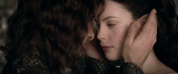 Movie still from “The Lord of the Rings: The Two Towers” (2002), directed by Peter Jackson – A person with their face on another person's face; Close Up shot, Over the shoulder angle