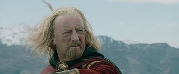 Movie still from “The Lord of the Rings: The Two Towers” (2002), directed by Peter Jackson – A person with long white hair; Close Up shot, Low angle
