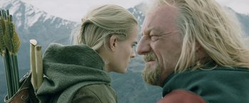 Movie still from “The Lord of the Rings: The Two Towers” (2002), directed by Peter Jackson – A man and a woman face to face in front of mountains; Close Up shot, Over the shoulder angle