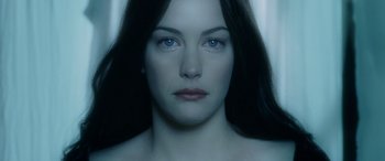 Movie still from “The Lord of the Rings: The Two Towers” (2002), directed by Peter Jackson – A person with long hair and blue eyes; Close Up shot, Over the shoulder angle