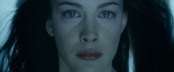Movie still from “The Lord of the Rings: The Two Towers” (2002), directed by Peter Jackson – A woman's face with tears falling down her face; Close Up shot, Overhead angle