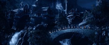 Movie still from “The Lord of the Rings: The Two Towers” (2002), directed by Peter Jackson – An image of a dark night with a bridge in the background; Extreme Wide shot, High angle
