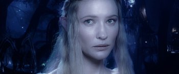 Movie still from “The Lord of the Rings: The Two Towers” (2002), directed by Peter Jackson – A person with long white hair; Close Up shot, High angle