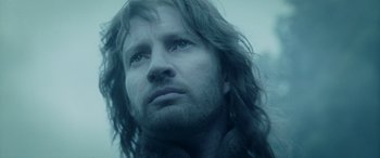 Movie still from “The Lord of the Rings: The Two Towers” (2002), directed by Peter Jackson – A person with long hair; Close Up shot, Low angle