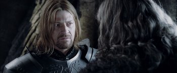 Movie still from “The Lord of the Rings: The Two Towers” (2002), directed by Peter Jackson – A person wearing a costume; Close Up shot, Over the shoulder angle