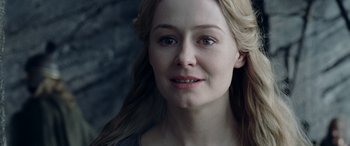 Movie still from “The Lord of the Rings: The Two Towers” (2002), directed by Peter Jackson – A person with long blonde hair; Close Up shot, Over the shoulder angle