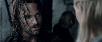 Movie still from “The Lord of the Rings: The Two Towers” (2002), directed by Peter Jackson – A person with long hair; Close Up shot, Over the shoulder angle