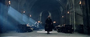 Movie still from “The Lord of the Rings: The Two Towers” (2002), directed by Peter Jackson – A group of people standing in a room with candles; Wide shot, Low angle