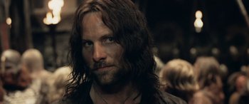 Movie still from “The Lord of the Rings: The Two Towers” (2002), directed by Peter Jackson – A person with long hair; Close Up shot, Over the shoulder angle