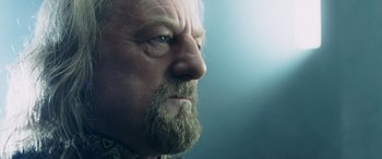 Movie still from “The Lord of the Rings: The Two Towers” (2002), directed by Peter Jackson – An older man with a beard and a mustache; Close Up shot, Over the shoulder angle