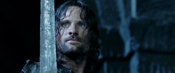 Movie still from “The Lord of the Rings: The Two Towers” (2002), directed by Peter Jackson – A person with wet hair; Close Up shot, Low angle