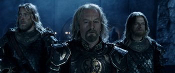 Movie still from “The Lord of the Rings: The Two Towers” (2002), directed by Peter Jackson – A person wearing a costume; Medium shot, Low angle