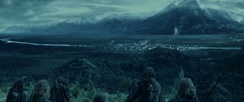 Movie still from “The Lord of the Rings: The Two Towers” (2002), directed by Peter Jackson – A view of a city from a hill; Extreme Wide shot, High angle