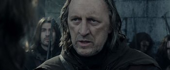 Movie still from “The Lord of the Rings: The Two Towers” (2002), directed by Peter Jackson – A person with long hair; Close Up shot, Over the shoulder angle