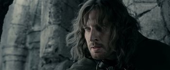 Movie still from “The Lord of the Rings: The Two Towers” (2002), directed by Peter Jackson – A person with long grey hair; Close Up shot, Over the shoulder angle