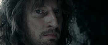 Movie still from “The Lord of the Rings: The Two Towers” (2002), directed by Peter Jackson – A person with long hair; Close Up shot, Over the shoulder angle