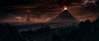 Movie still from “The Lord of the Rings: The Two Towers” (2002), directed by Peter Jackson – An image of an eruption of a volcano in the night sky; Extreme Wide shot, High angle