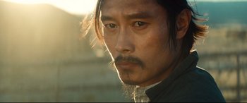 Movie still from “The Magnificent Seven” (2016), directed by Antoine Fuqua – A person with a beard and a mustache; Close Up shot, Low angle