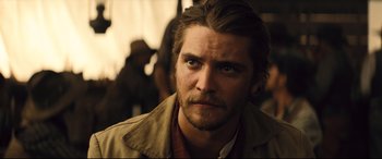 Movie still from “The Magnificent Seven” (2016), directed by Antoine Fuqua – A person wearing a jacket; Close Up shot, Over the shoulder angle