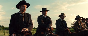 Movie still from “The Magnificent Seven” (2016), directed by Antoine Fuqua – Medium shot, Low angle