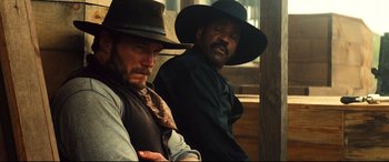 Movie still from “The Magnificent Seven” (2016), directed by Antoine Fuqua – Medium shot, Over the shoulder angle