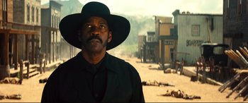 Movie still from “The Magnificent Seven” (2016), directed by Antoine Fuqua – A man in a black shirt and a black cowboy hat; Close Up shot, Low angle