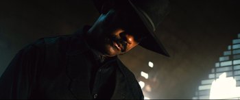 Movie still from “The Magnificent Seven” (2016), directed by Antoine Fuqua – A person wearing a cowboy hat; Close Up shot, Low angle