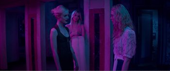 Movie still from “The Neon Demon” (2016), directed by Nicolas Winding Refn – Medium shot, Over the shoulder angle