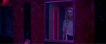 Movie still from “The Neon Demon” (2016), directed by Nicolas Winding Refn – Medium shot, Over the shoulder angle