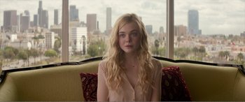Movie still from “The Neon Demon” (2016), directed by Nicolas Winding Refn – Medium shot, Over the shoulder angle