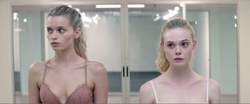 Movie still from “The Neon Demon” (2016), directed by Nicolas Winding Refn – Close Up shot, Over the shoulder angle