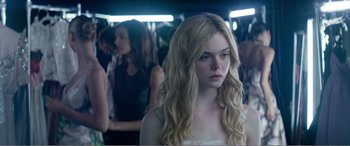 Movie still from “The Neon Demon” (2016), directed by Nicolas Winding Refn – Medium shot, Over the shoulder angle
