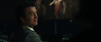 Movie still from “The Offer” (2022), directed by Dexter Fletcher – A man sitting in front of a painting in a dark room; Close Up shot, Over the shoulder angle