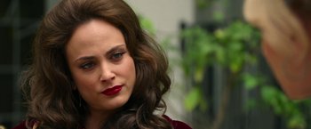 Movie still from “The Offer” (2022), directed by Dexter Fletcher – A person with long hair; Close Up shot, Over the shoulder angle