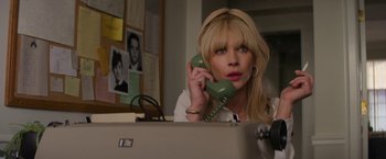 Movie still from “The Offer” (2022), directed by Dexter Fletcher – A woman holding a phone up to her ear; Close Up shot, Low angle