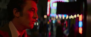 Movie still from “The Offer” (2022), directed by Dexter Fletcher – A man's face in the dark; Close Up shot, Low angle