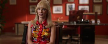 Movie still from “The Offer” (2022), directed by Dexter Fletcher – A woman sitting in a chair in a room; Close Up shot, Over the shoulder angle