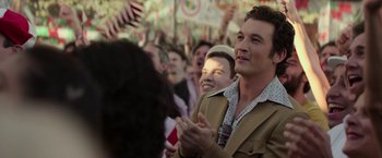 Movie still from “The Offer” (2022), directed by Dexter Fletcher – A man clapping his hands in front of a crowd; Close Up shot, Over the shoulder angle