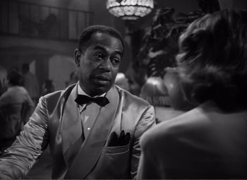 Movie still from “Casablanca” (1942), directed by Michael Curtiz – A black and white photo of a man and a woman; Medium shot, Over the shoulder angle