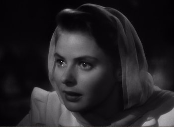 Movie still from “Casablanca” (1942), directed by Michael Curtiz – A black - and - white photo of a woman wearing a veil; Close Up shot, High angle