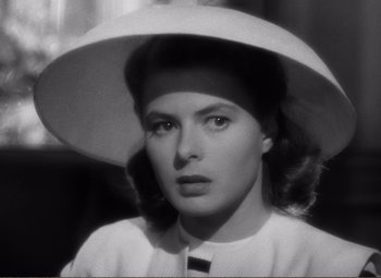 Movie still from “Casablanca” (1942), directed by Michael Curtiz – A black - and - white photo of a woman wearing a hat; Close Up shot, Low angle