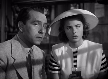 Movie still from “Casablanca” (1942), directed by Michael Curtiz – A man and a woman are sitting next to each other; Close Up shot, Low angle