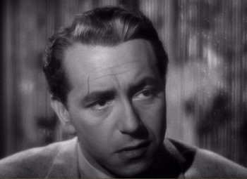 Movie still from “Casablanca” (1942), directed by Michael Curtiz – An old black and white photo of a man looking at the camera; Close Up shot, High angle