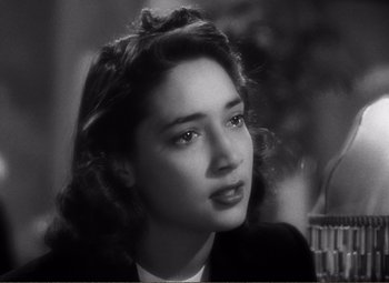 Movie still from “Casablanca” (1942), directed by Michael Curtiz – A black - and - white photo of a young woman; Close Up shot, High angle