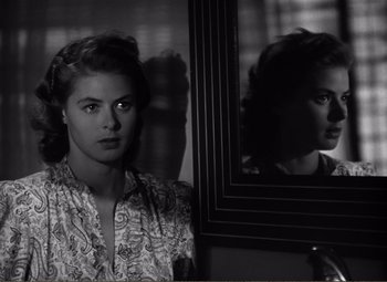 Movie still from “Casablanca” (1942), directed by Michael Curtiz – A black - and - white photo of a woman in front of a mirror; Close Up shot, Over the shoulder angle