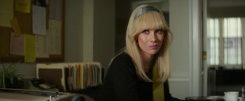Movie still from “The Offer” (2022), directed by Dexter Fletcher – A woman with blonde hair wearing a blue headband; Close Up shot, Over the shoulder angle