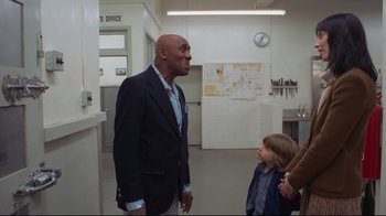 Movie still from “The Shining” (1980), directed by Stanley Kubrick – An older man and a young boy are in a room; Medium shot, Over the shoulder angle