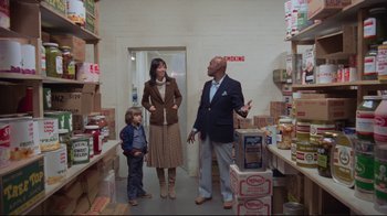 Movie still from “The Shining” (1980), directed by Stanley Kubrick – A man and a woman and a child in a warehouse; Medium shot, Over the shoulder angle