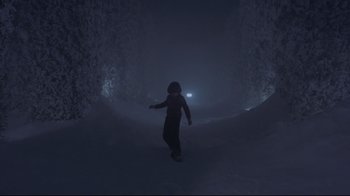 Movie still from “The Shining” (1980), directed by Stanley Kubrick – A person is walking in the snow at night; Wide shot, Low angle