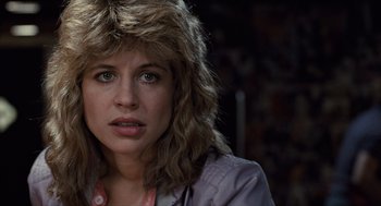 Movie still from “The Terminator” (1984), directed by James Cameron – A person wearing a jacket; Close Up shot, Over the shoulder angle